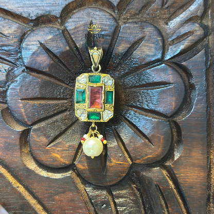 Elegant 18kt Gold Pendant with Red and Green Gemstones and Polki Diamonds